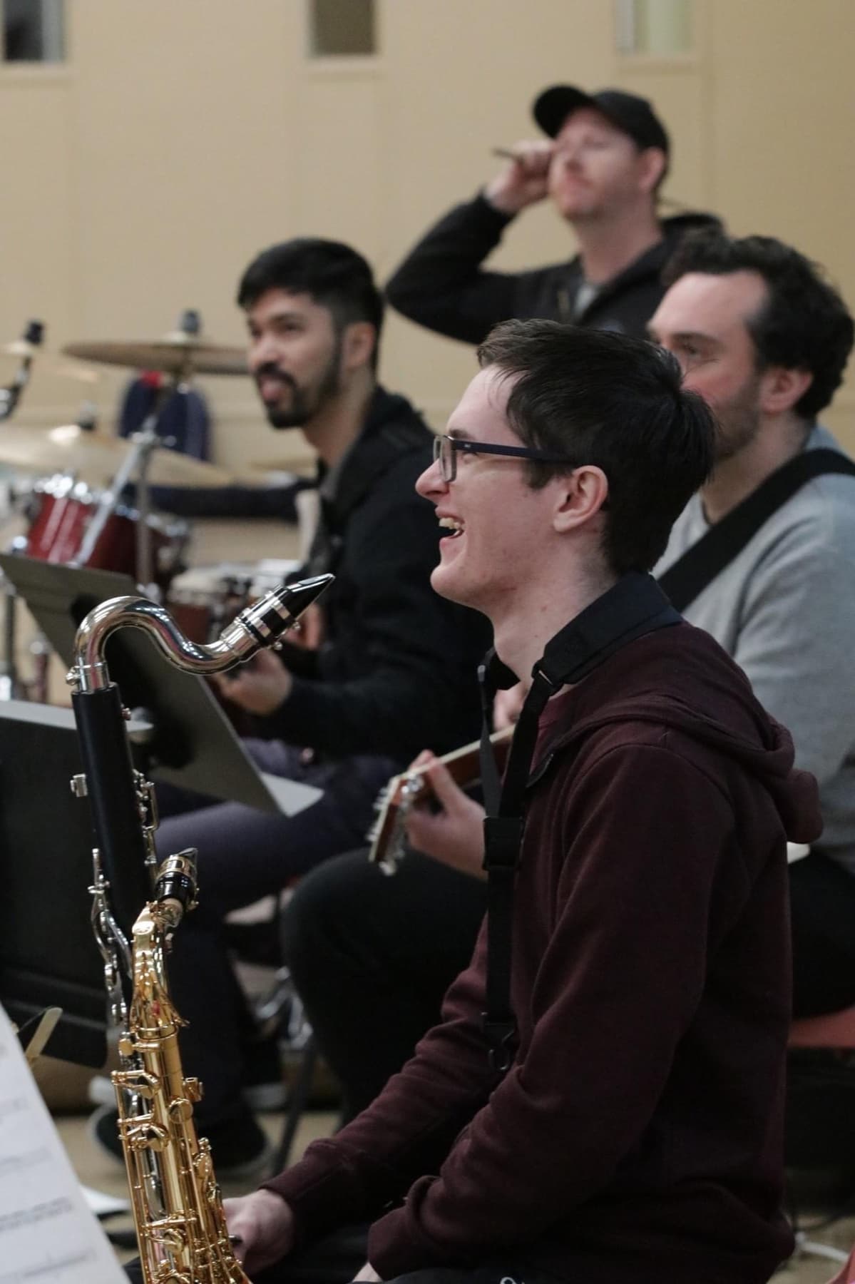 Matthew Rumley with clarinet and saxophone in rehearsal